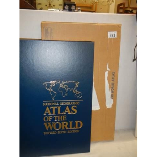 473 - A large boxed and new world atlas.