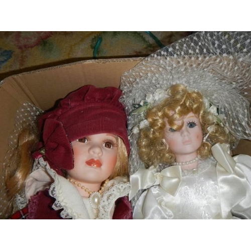 475 - Two good porcelain collector's dolls.