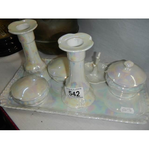 542 - A ceramic dressing table set.