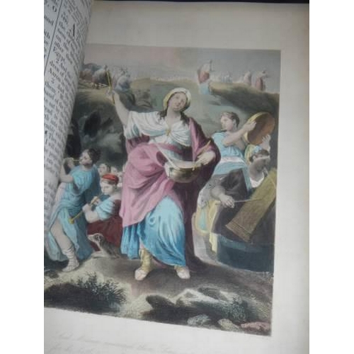 558 - A large family bible with lots of coloured plates.