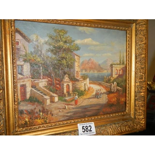 582 - A Good gilt framed continental street scene signed H Torburg.