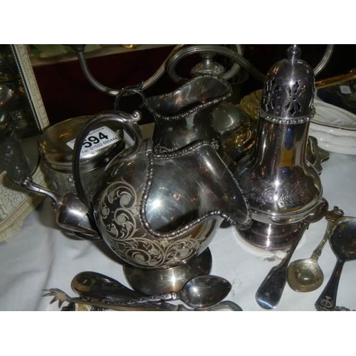 594 - A mixed lot including sugar sifter, sugar scuttle, napkin rings etc.,