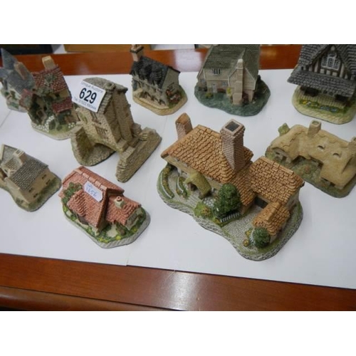 629 - A quantity of cottages including Lilliput lane.