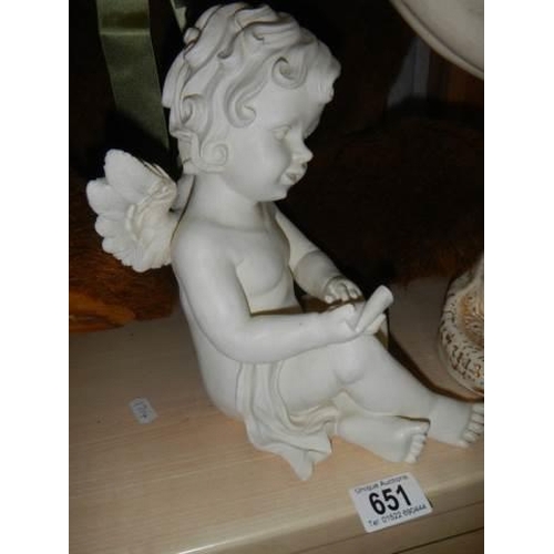 655 - A mermaid soap dish and a cherub figure.