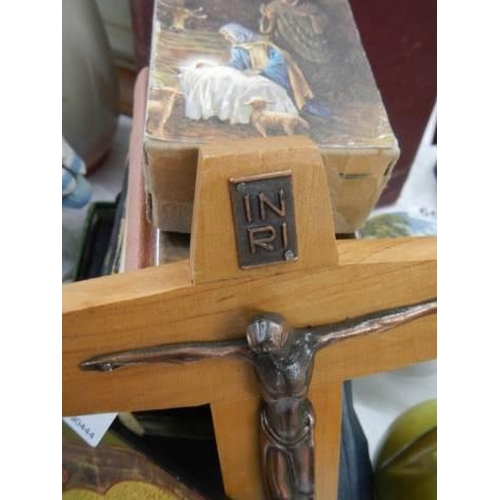 667 - A quantity of old bibles, a crucifix etc.,