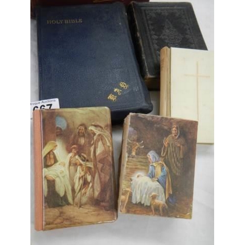 667 - A quantity of old bibles, a crucifix etc.,