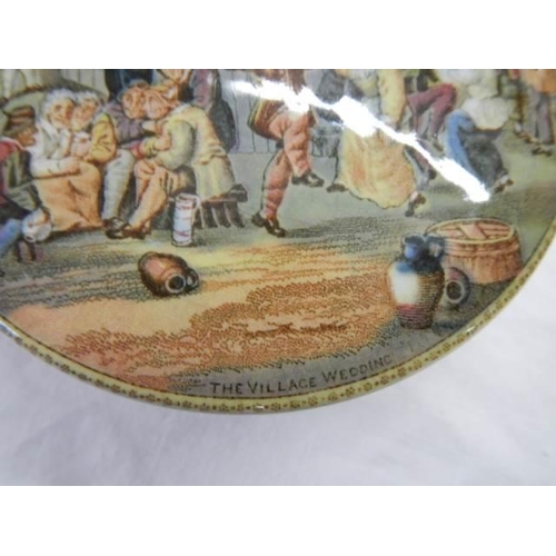 668 - A Prattware pot lid 'The Village Wedding' a/f.