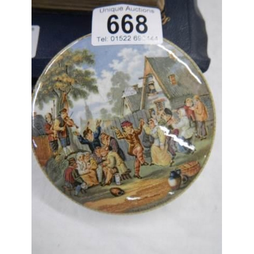 668 - A Prattware pot lid 'The Village Wedding' a/f.