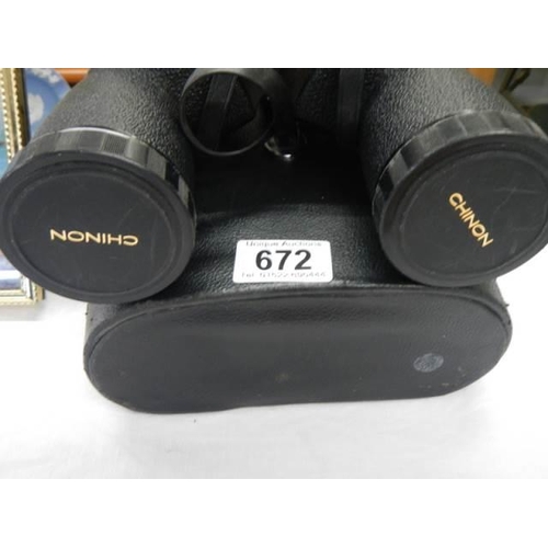 672 - A cased pair of 10 x 50 Chinon binoculars.