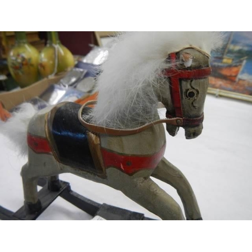 677 - A miniature rocking horse.