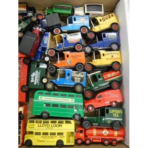 680 - A mixed lot of die cast buses and vans.