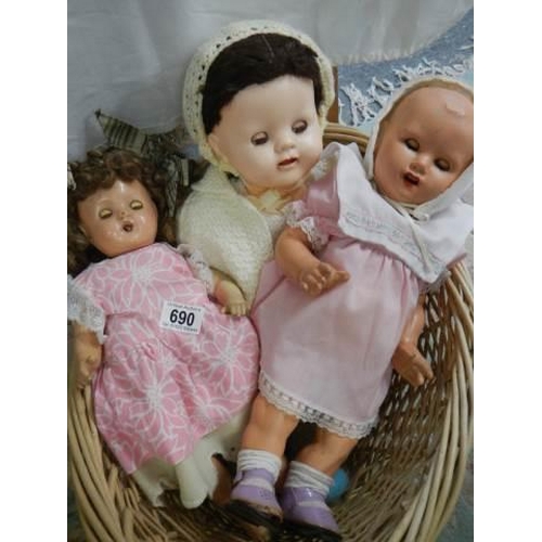 690 - Three vintage dolls.