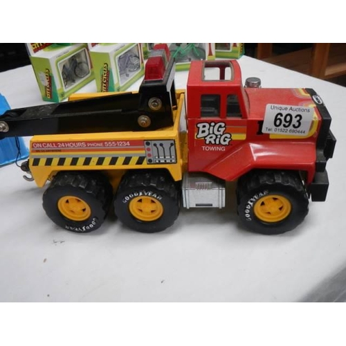 693 - A toy Big Rig towing truck.