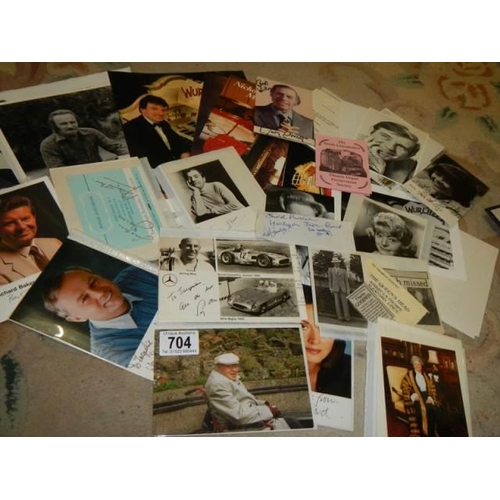 704 - An interesting collection of original signed photographs including some letters - Sterling Moss, Ack... 