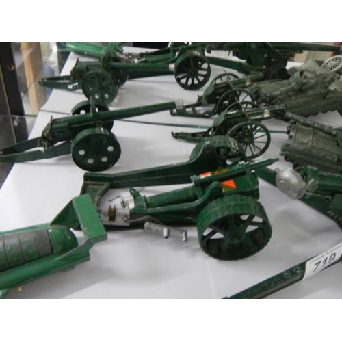 719 - A quantity of military die cast including tanks, field guns etc.,