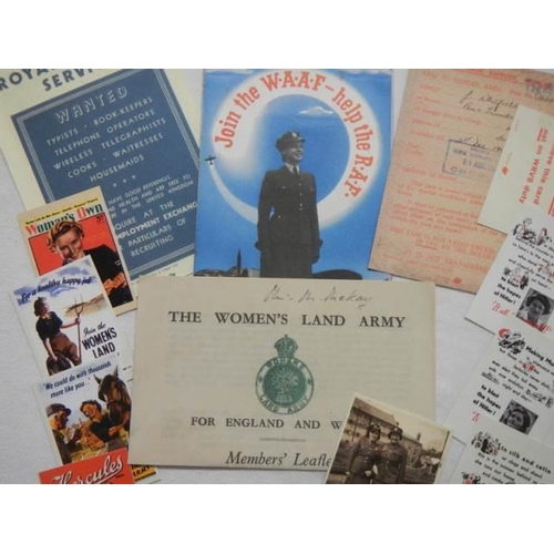 725 - A mixed lot of WRNS and Land Girls memorabilia.