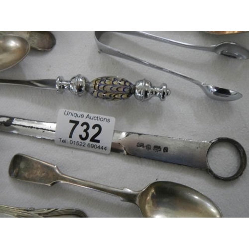 732 - A mixed lot of teaspoons, sugar nips, skewer, letter opener etc.,