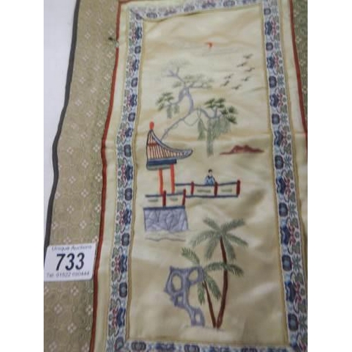 733 - A Chinese embroidered panel.