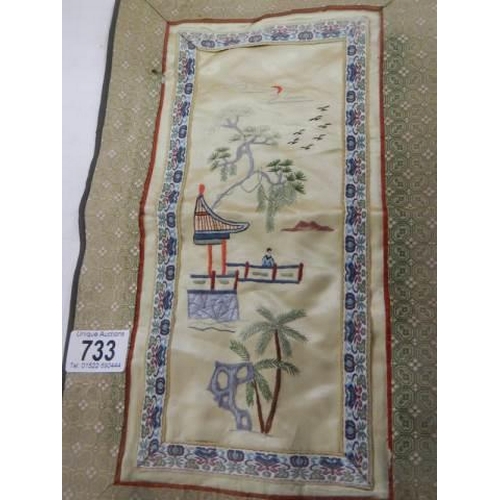 733 - A Chinese embroidered panel.