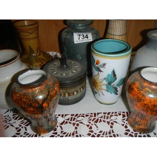 734 - A mixed lot of ceramic vases and pots.