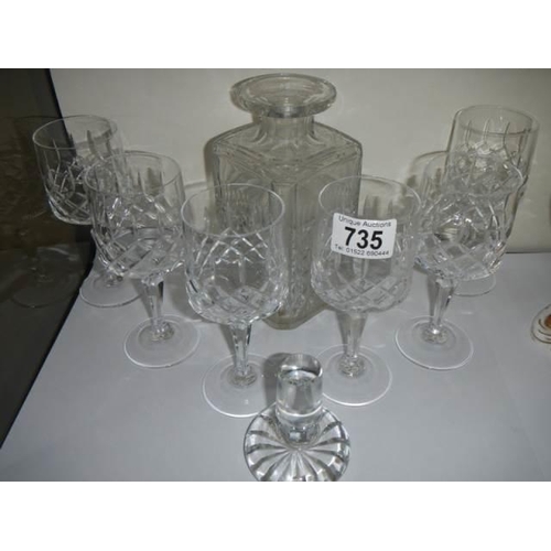 735 - A cut glass decanter with six glasses.