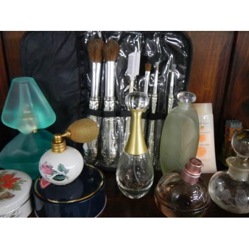 761 - A mixed lot of perfume bottles and other vanity items etc.,