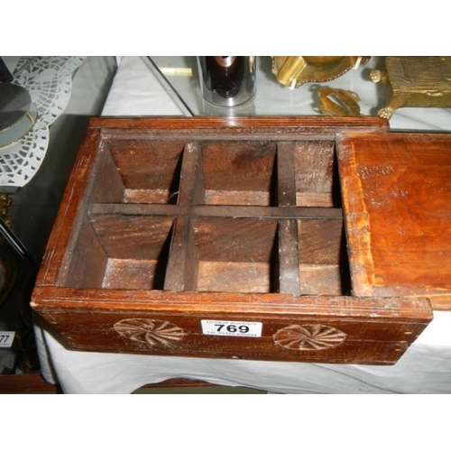 769 - A six compartment box with sliiding top.