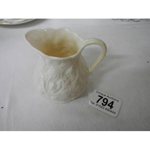 794 - A Belleek cream jug.