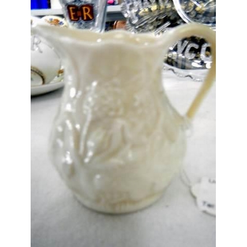 794 - A Belleek cream jug.