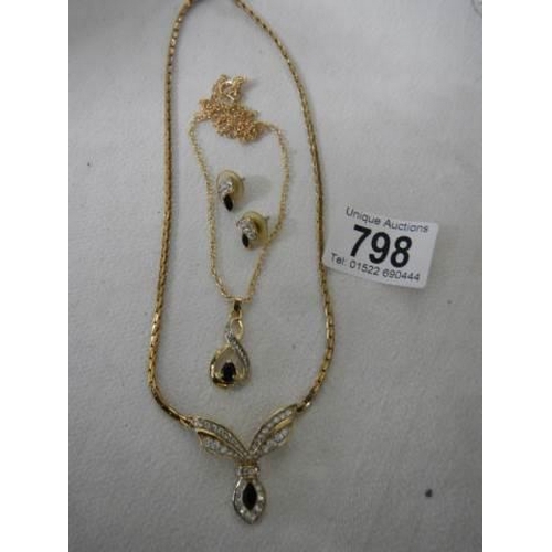 798 - A necklace with matching earrings and a pendant.