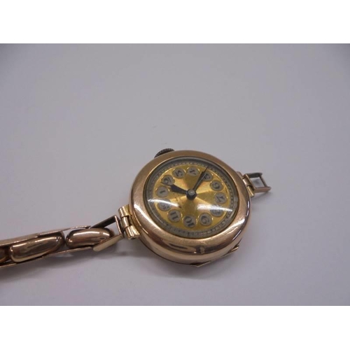 1003 - A 9ct gold ladies wrist watch in working order but bracelet a/f, 18 grams.