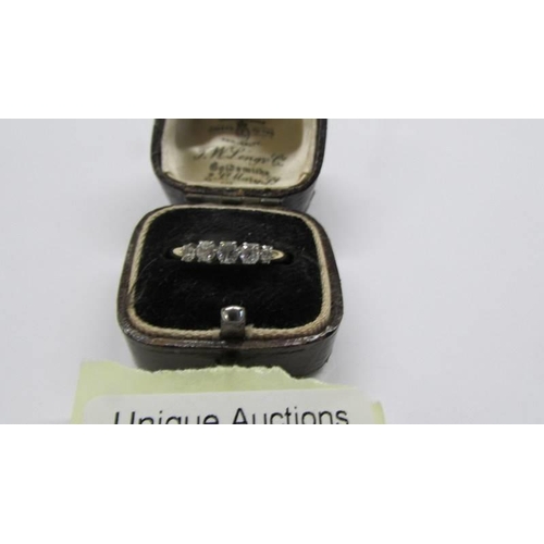 1018 - A five stone diamond ring, hall mark rubbed, size P, 2.1 grams.