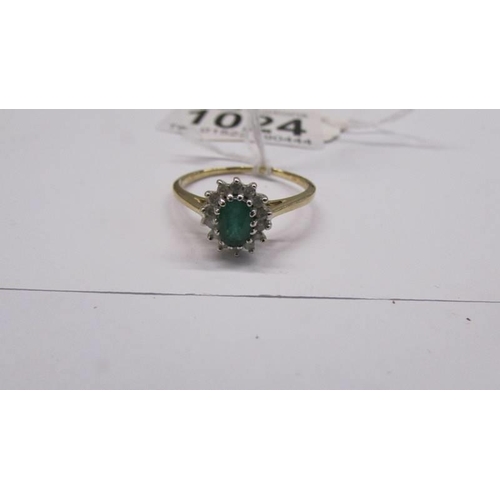 1024 - An 18ct yellow gold diamond and emerald ring, size S, 2.2 grams.