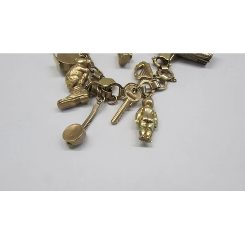 1039 - A 9ct gold charm bracelet, most charms marked, some unmarked but assured gold. 25 grams.