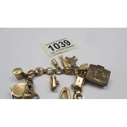 1039 - A 9ct gold charm bracelet, most charms marked, some unmarked but assured gold. 25 grams.