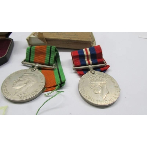 1042 - An imperial Service Medal awarded to David Glyn Jenkings and two WW2 medals for the same person.