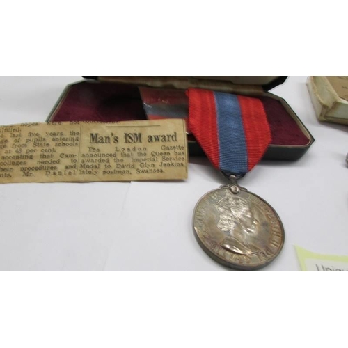 An imperial Service Medal awarded to David Glyn Jenkings and two WW2 ...