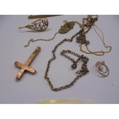 1045 - Approximately 12 grams of 9ct gold including tie pins, cross etc.,