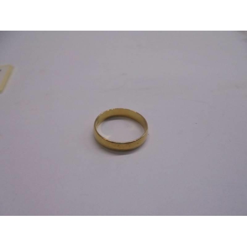 1057 - Two 18ct gold wedding rings, sizes I and J half, 9.3 grams.