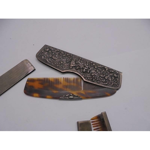 1114 - Two silver cased comb, another comb and two charm bracelets.