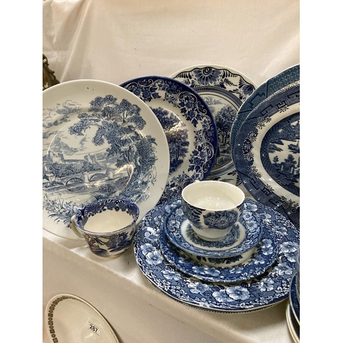 299 - A good quantity of willow & other blue & white china & iron stone items