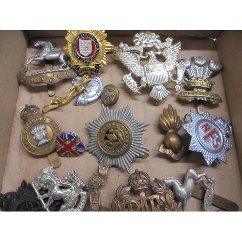 1115 - A good lot of assorted military badges etc.,