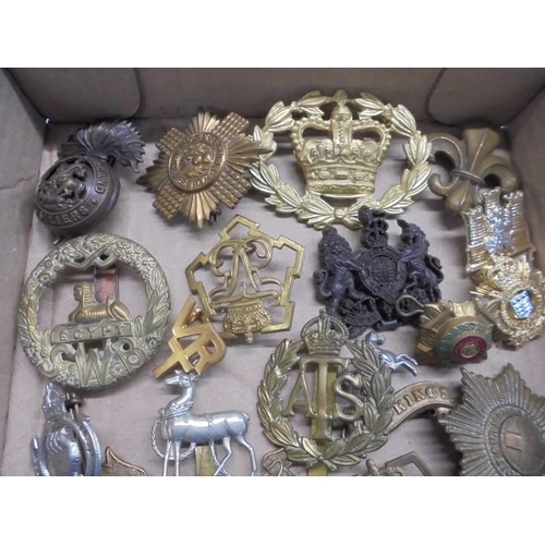 1115 - A good lot of assorted military badges etc.,