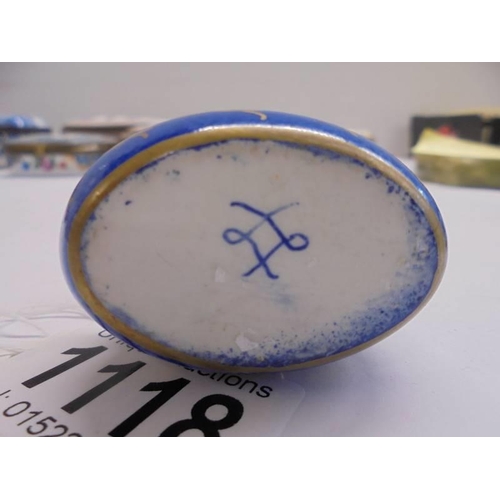 1118 - A fine 19th century hand painted porcelain patch box with crossed swords mark, 5 x 3 cm.