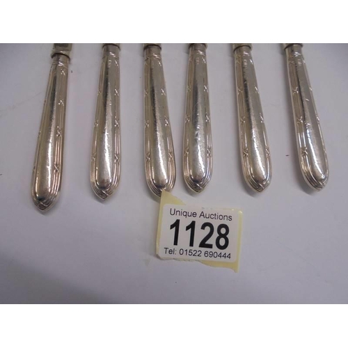 1128 - A set of six silver handled butter knives, I S G Sheffield.