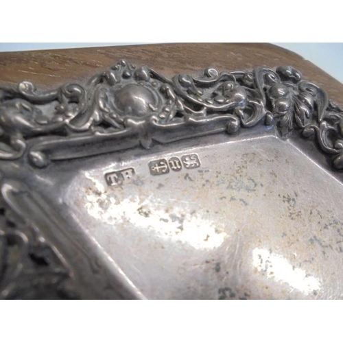 1130 - A silver diamond shaped dish on an oak base, hall mark for Birmingham.