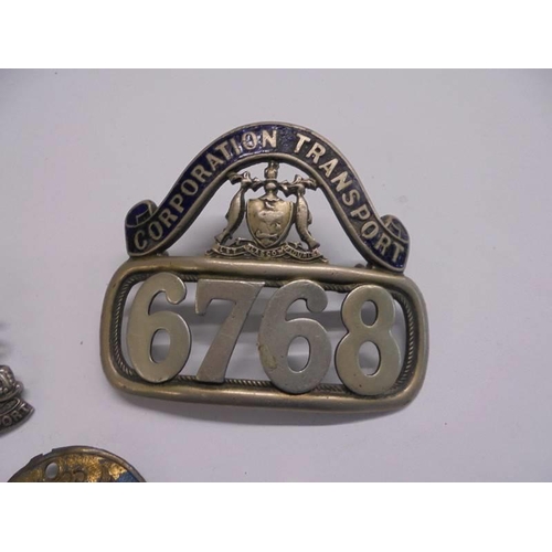 1145 - Glasgow Corporation Transport and Manchester Corporation Transport cap badges.