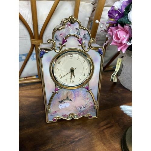 400 - A Bradford Exchange clock, Tranquil garden figure, floral centre piece and 1 other