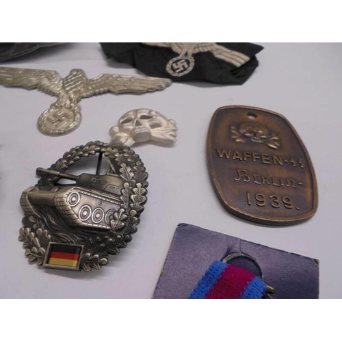 1152 - A tray of WW2 German style badges and patches.