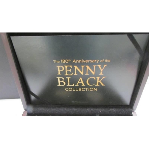 1164 - A cased 'Penny Black Collection' comprising a silver penny black and an 1840 penny black.